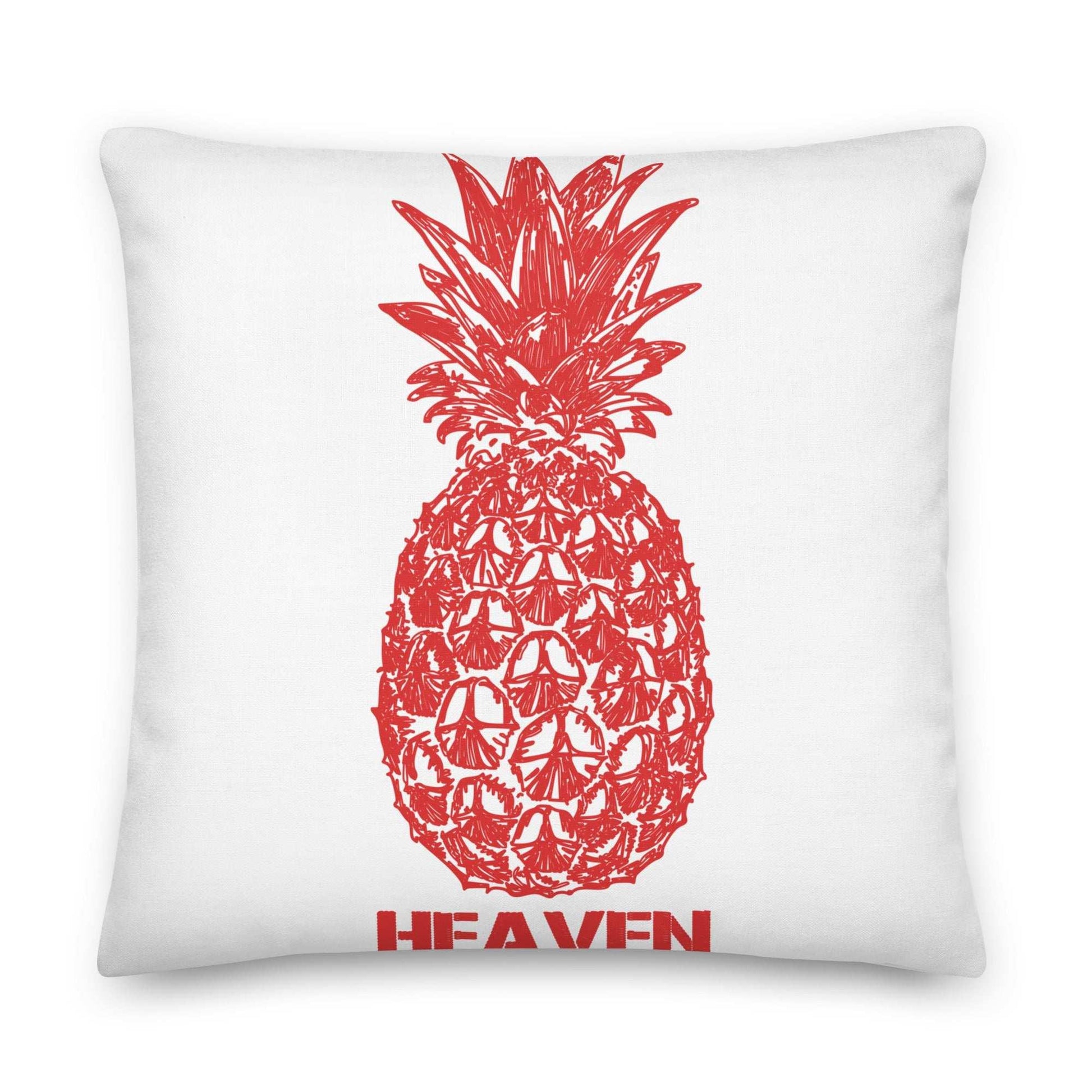 White pillow with a red pineapple design and the word "HEAVEN" below it.