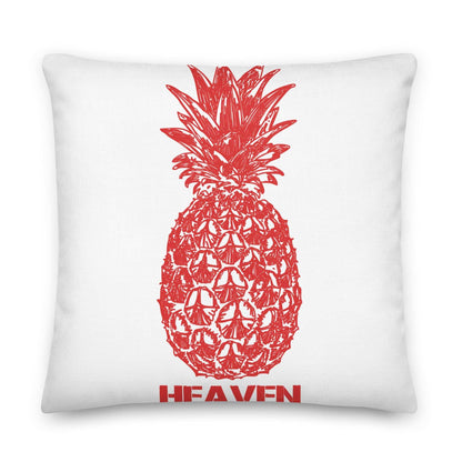 White pillow with a red pineapple design and the word "HEAVEN" below it.