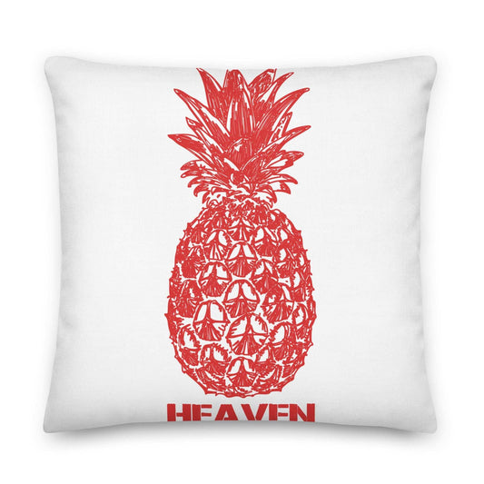 White pillow with a red pineapple design and the word "HEAVEN" below it.